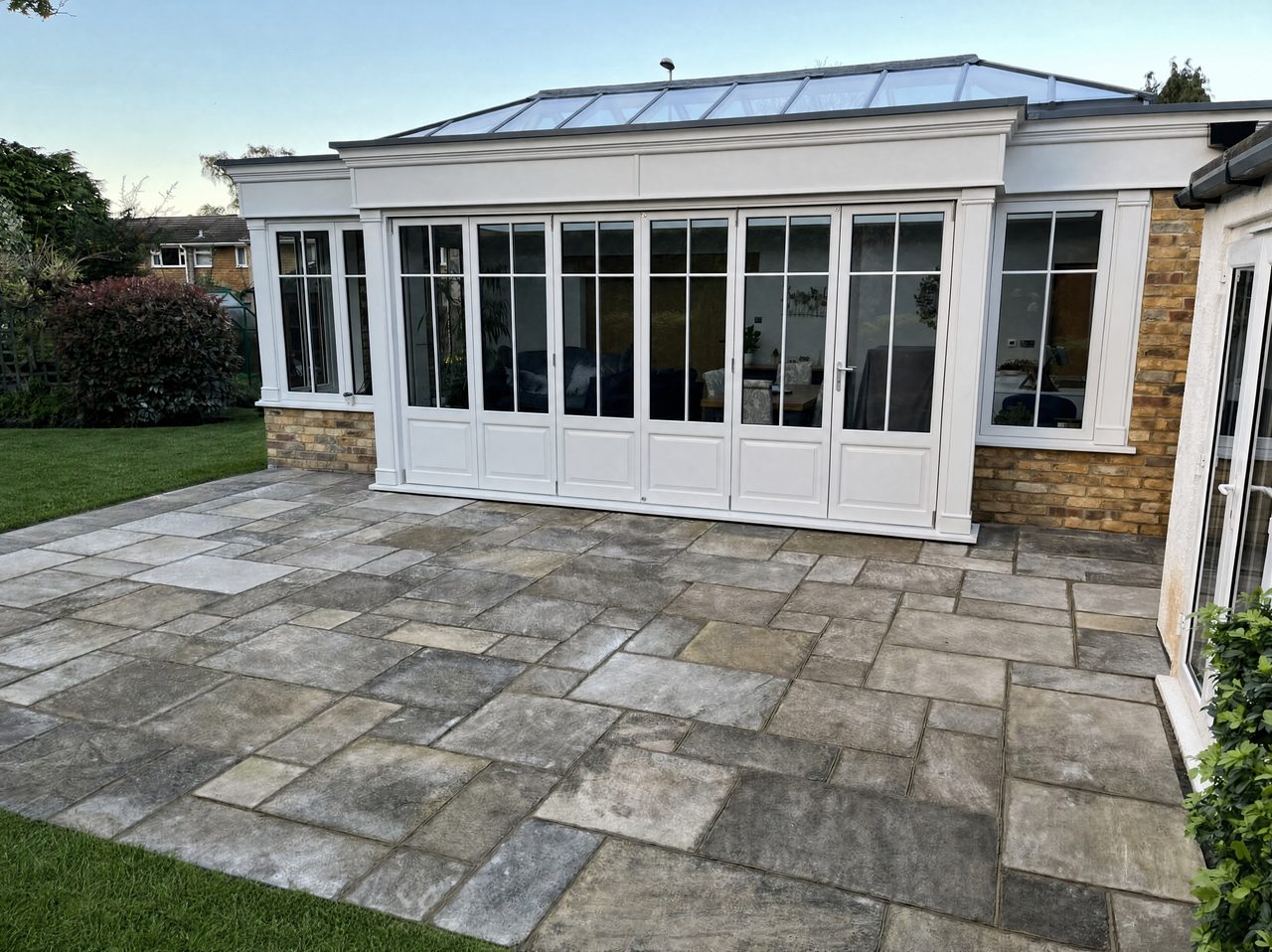 An orangery extension with a large natural stone patio, built by WJMProjects
