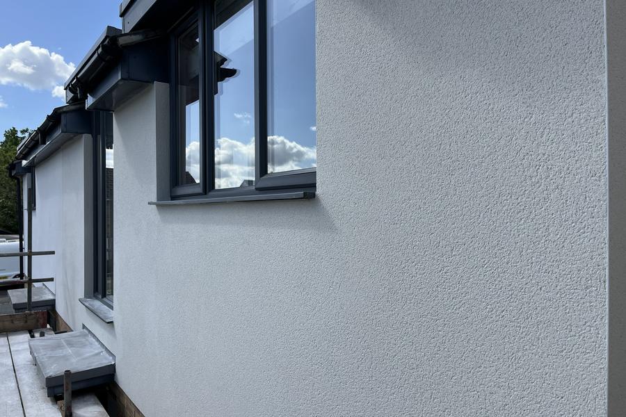 A house extension finished in smooth, even external render
